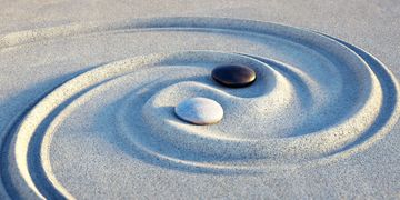 Image of 2 stones in sand.