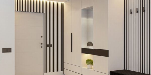 Modern hallway with white cabinetry and black-striped wall design.