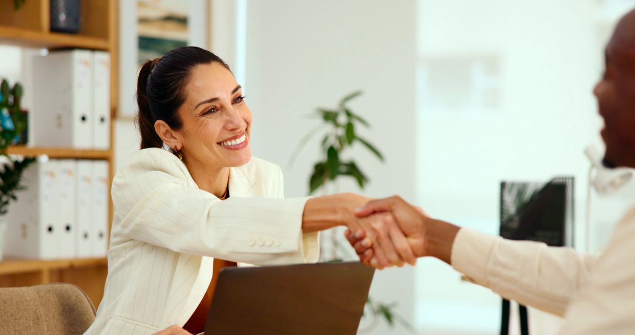 Woman shaking hands with man