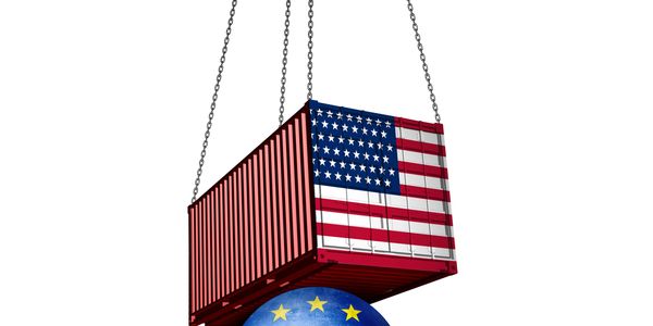 Shipping container with US flag lifted above globe with EU flag.