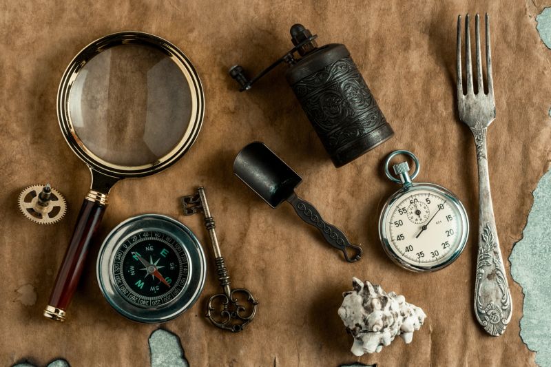 Vintage still life with compass, stopwatch, key, magnifying glass and seashell