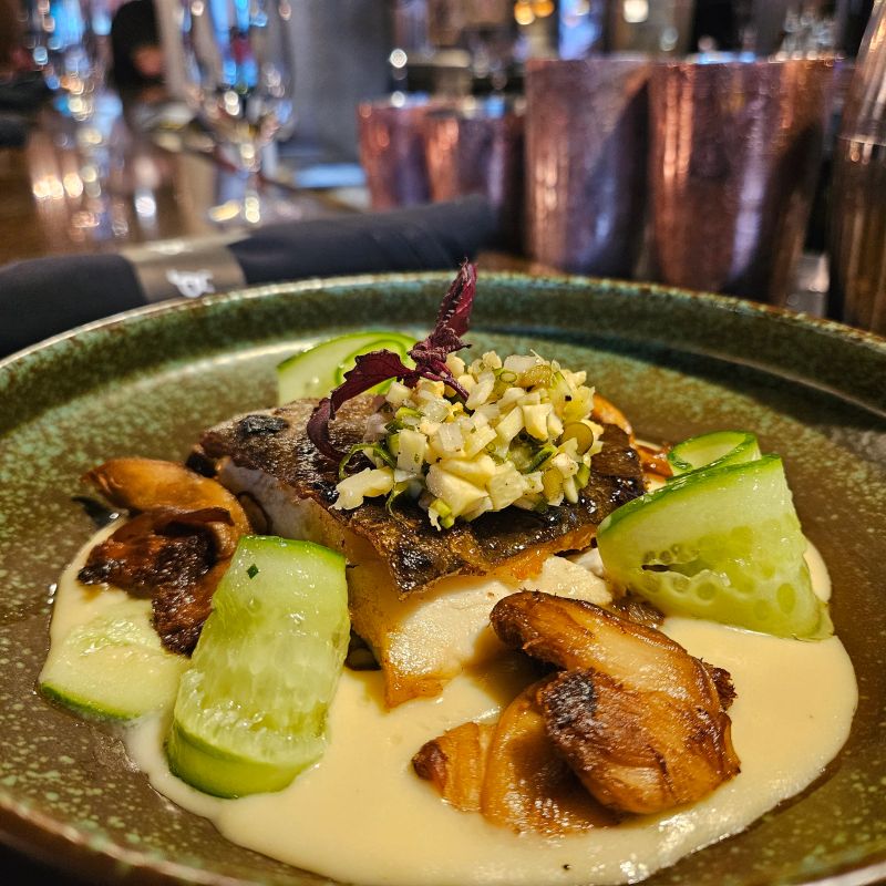 Portion of white cooked fish art of plating restaurant style