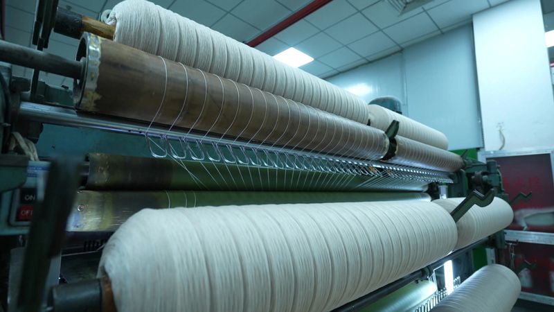 Carding machines in a woolen sweater factory