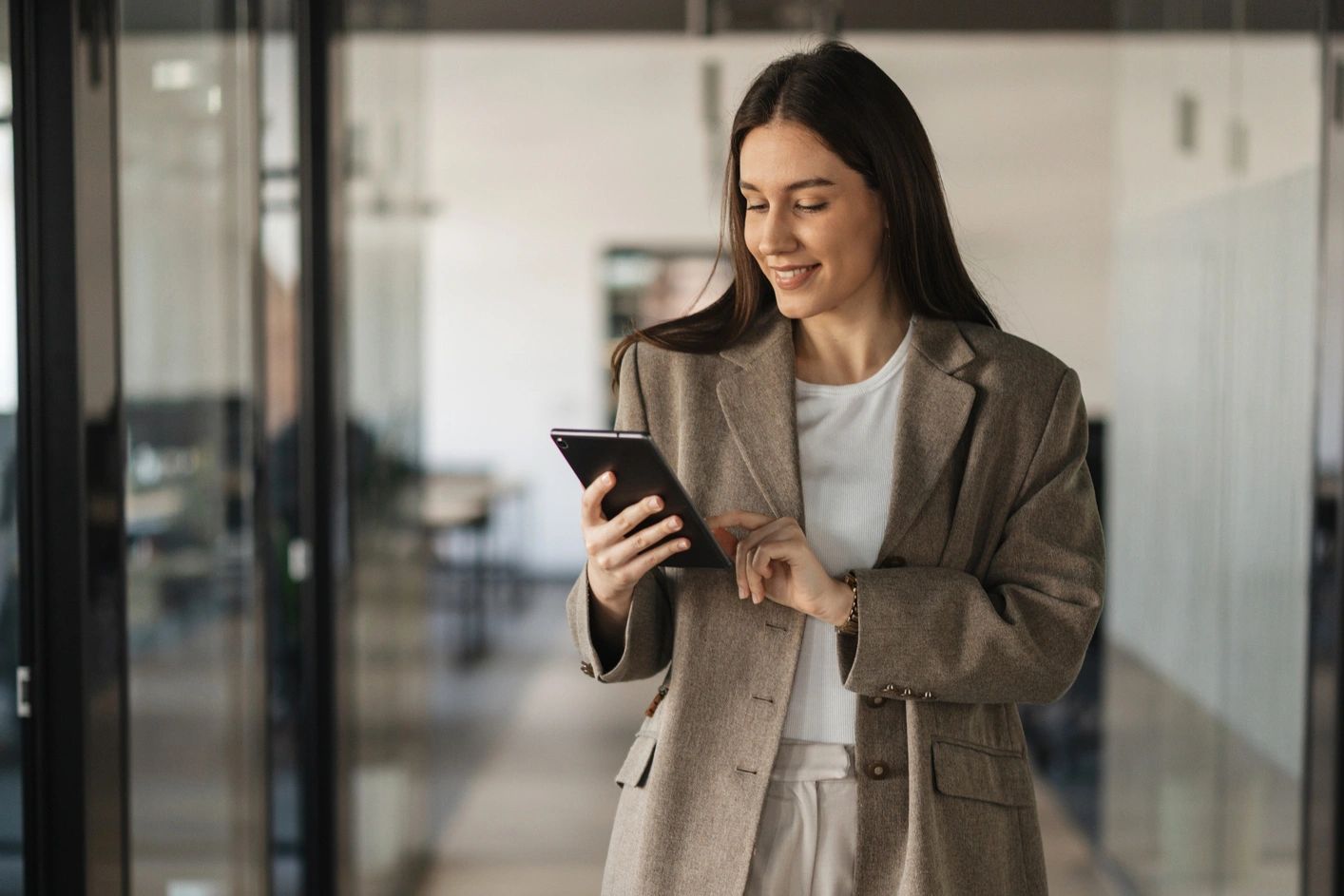 San Diego skyline at sunset with calm water reflections.