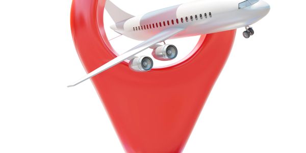 Airplane flying through a large red location pin symbol.