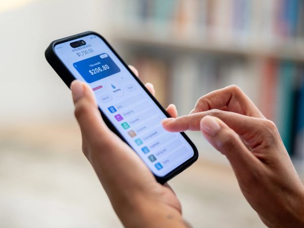 Person managing finances on a smartphone app.