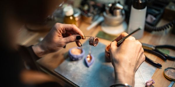 Artisan working on jewelry crafting.