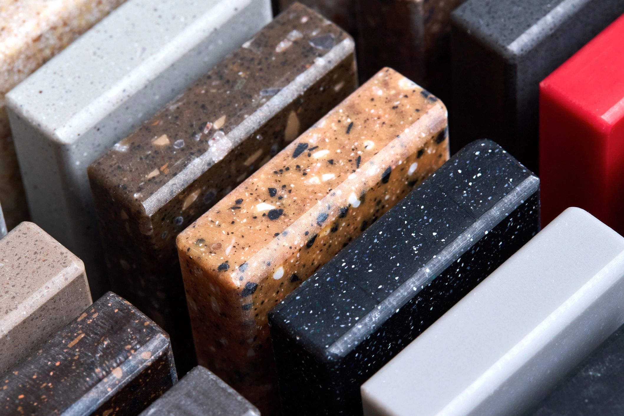 a close up photo of a variety of countertop samples. 