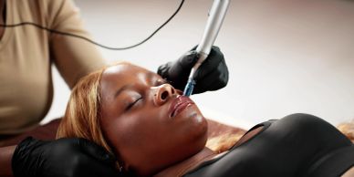Woman receiving a facial treatment.