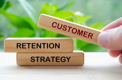 Wooden blocks showing customer retention strategy concept.