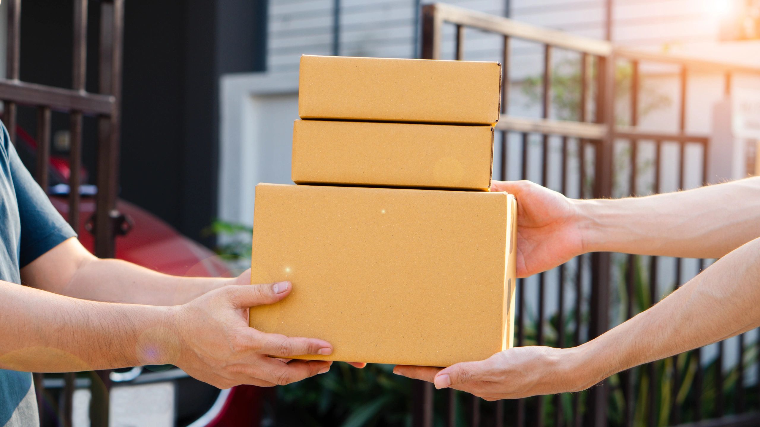 Parcels being exchanged between courier and customer 