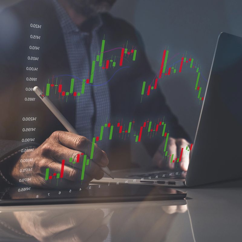 Businessman analysing forex graph, market data trading. Investment growth chart. Finance concept.
