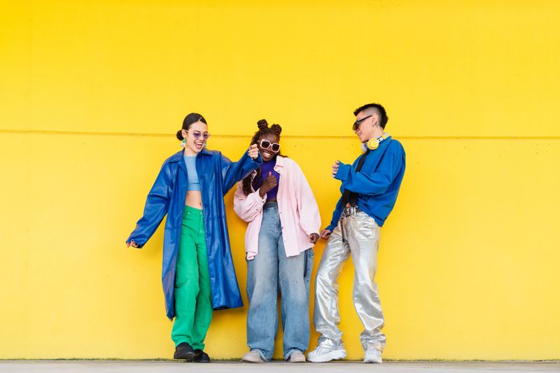 Three stylish young people having fun