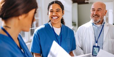 Medical professionals sharing a positive moment during a discussion.