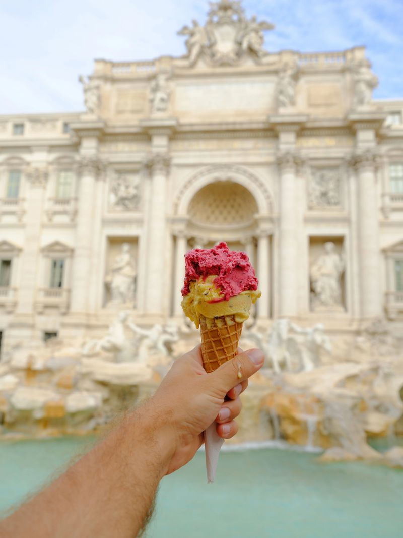 Vibrant gelato  on the background of Trevi fountain in Rome, Italy