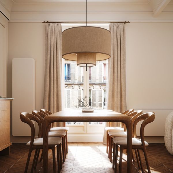 Elegant dining room with wooden furniture and large window.