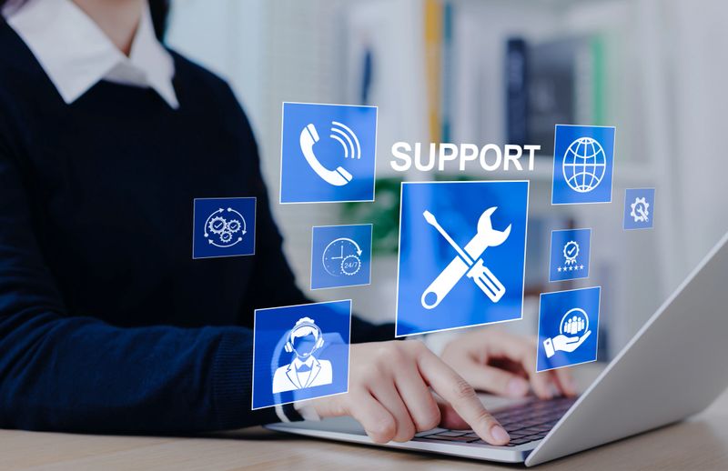 Technical support and customer service concept. Woman using laptop with support icons, representing technical assistance, customer service, and 24/7 help solutions in business. call center, help desk,