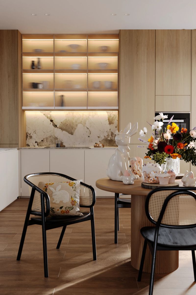 Discover the elegance of spring interior design with our 3D visualization of a modern brown wooden table, surrounded by dark boho chairs. In the background, there are natural brown kitchen furniture that harmoniously harmonizes with illuminated cabinets displaying beautiful dishes. On the table are Easter decorations, including a bouquet of colorful field and garden flowers, sweet cupcakes and a cute rabbit figurine, which adds spring charm and joy. The perfect photo for people looking for inspiration for interior design, Easter table decorations and lovers of the boho style.