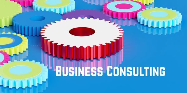 Colorful interlocking gears symbolize teamwork in business consulting.