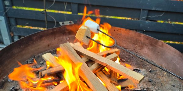 Marshmallows roasting over a fire pit.