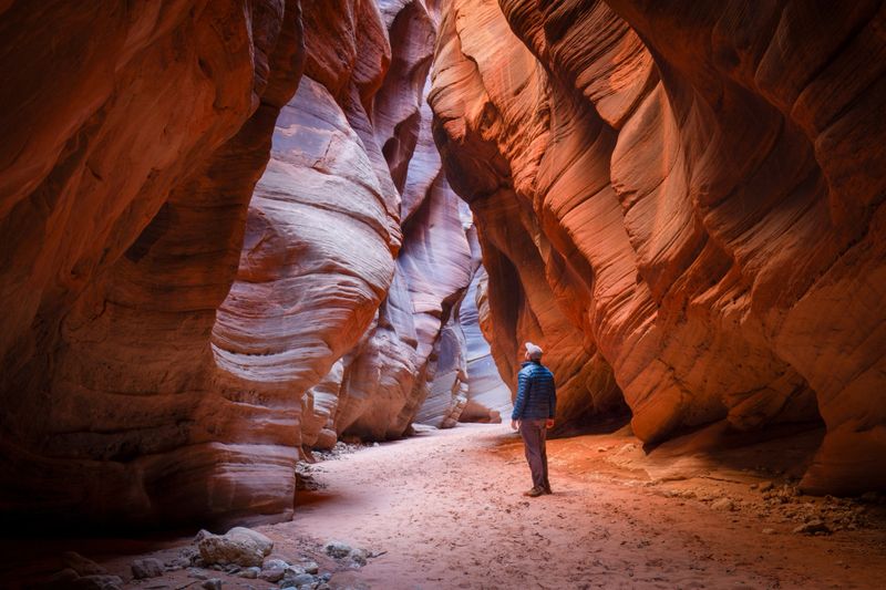 Lone hiker in Buckskin Gulch slot canyon - Utah, USA