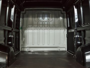 Empty cargo space inside a black delivery van.