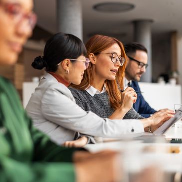 A group of people collaborating in a meeting.