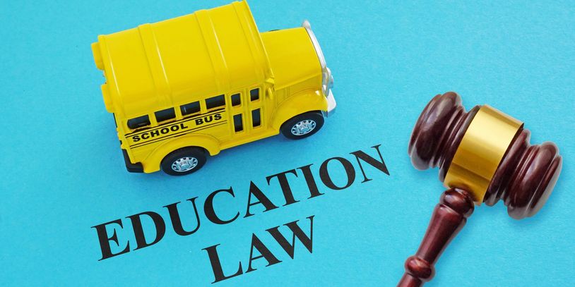 Image showing yellow school bus alongside the words "EDUCATION LAW" and a judge's gavel.