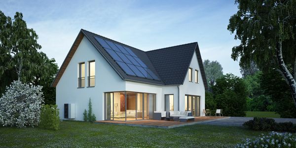 Modern house with solar panels and garden.