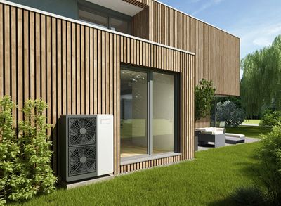 Modern house with wooden paneling and an outdoor air conditioning unit.