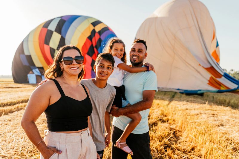 Happy child playing with colorful balloons during a photo shoot
