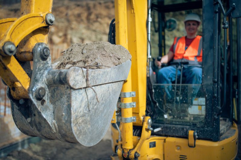 Shot of a mid adult male excavator driver on a construction site.