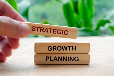 Wooden blocks with strategic growth planning words.