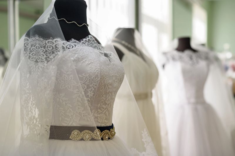Elegant bridal gowns displayed in a chic boutique setting