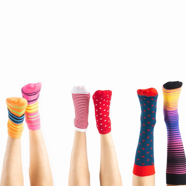Feet with different colored socks. 