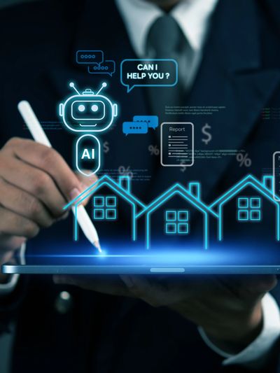 Businessman using tablet with AI chatbot and digital house graphics.