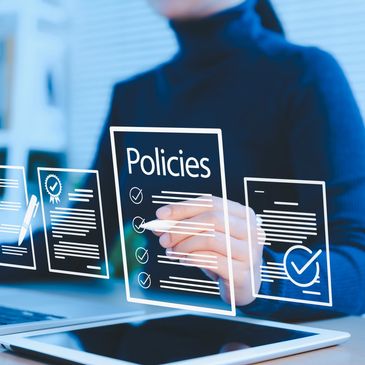 Person interacting with digital policy documents.