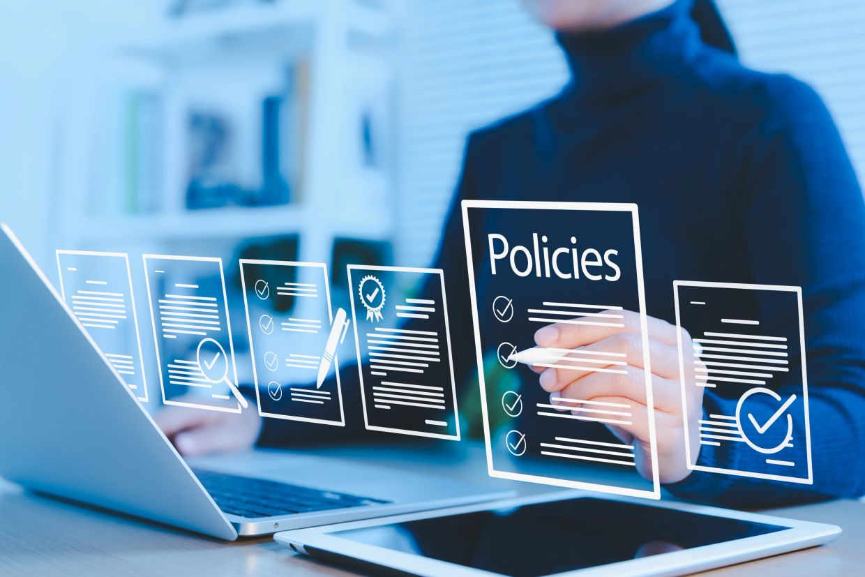 Digital interface showcasing policies and documents with checkmarks and a person interacting.