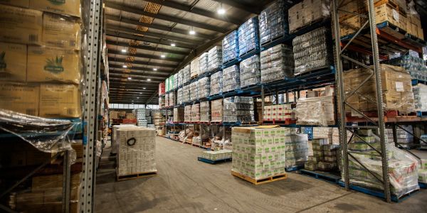 Large warehouse with stacked pallets of goods.