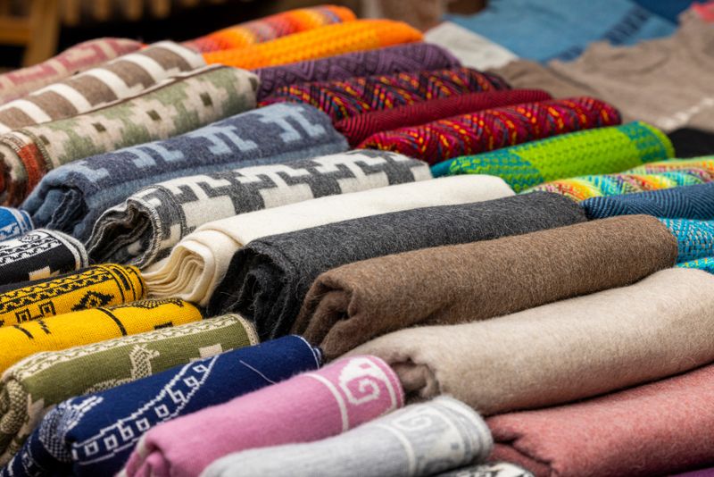 Traditional Andean sweaters from Cusco, Peru, featuring vibrant patterns and handwoven alpaca wool craftsmanship