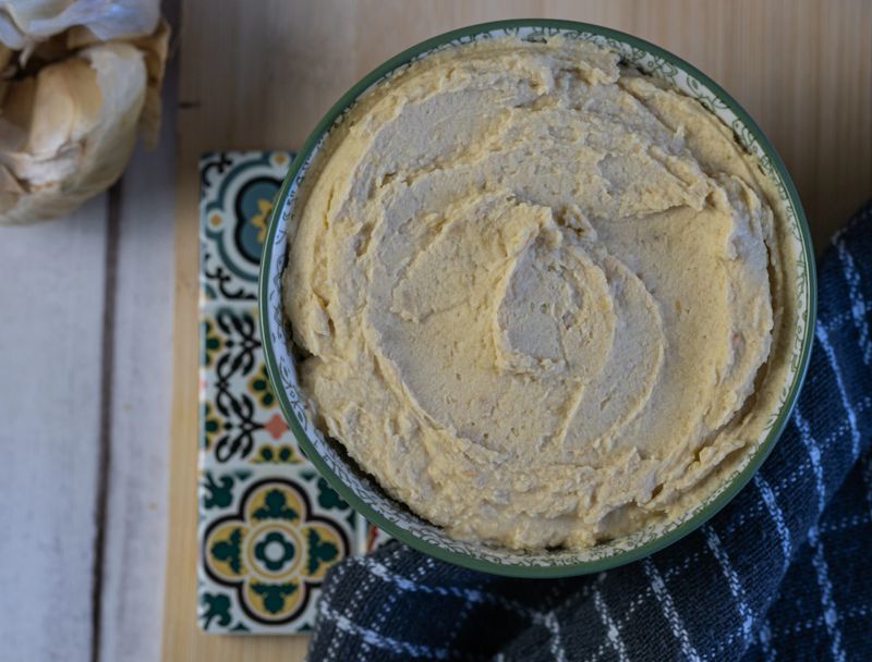 Nice bowl of hummus, a traditional Middle Eastern vegetarian dish made from chickpeas.