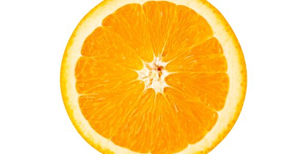Close-up of a fresh orange slice showing its juicy segments.