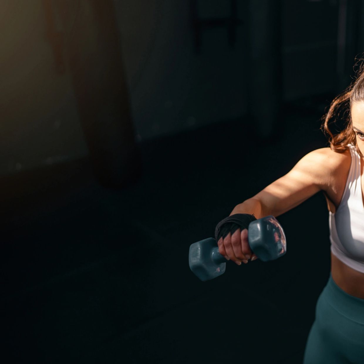 A multi-functional gym machine with weights in a fitness center.