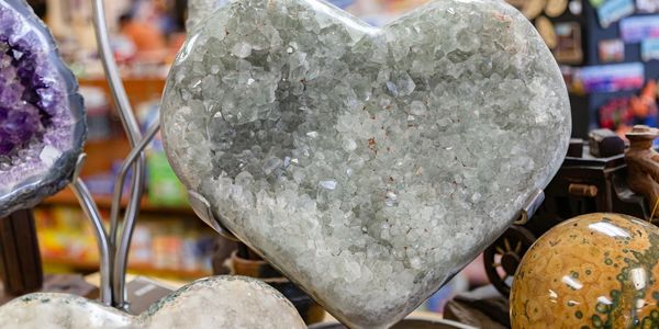 Heart-shaped crystal geode displayed in a shop.