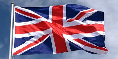 United Kingdom union flag flying from a flag pole.