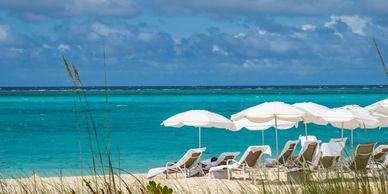 Beach Chairs lined up on a white sand beach in Turks and Caicos