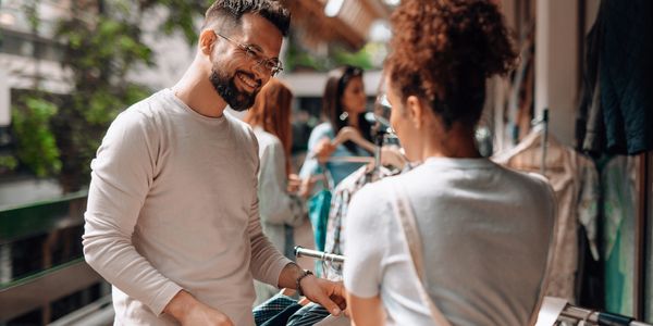 a happy employee helps secure a positive customer experience during the purchase process