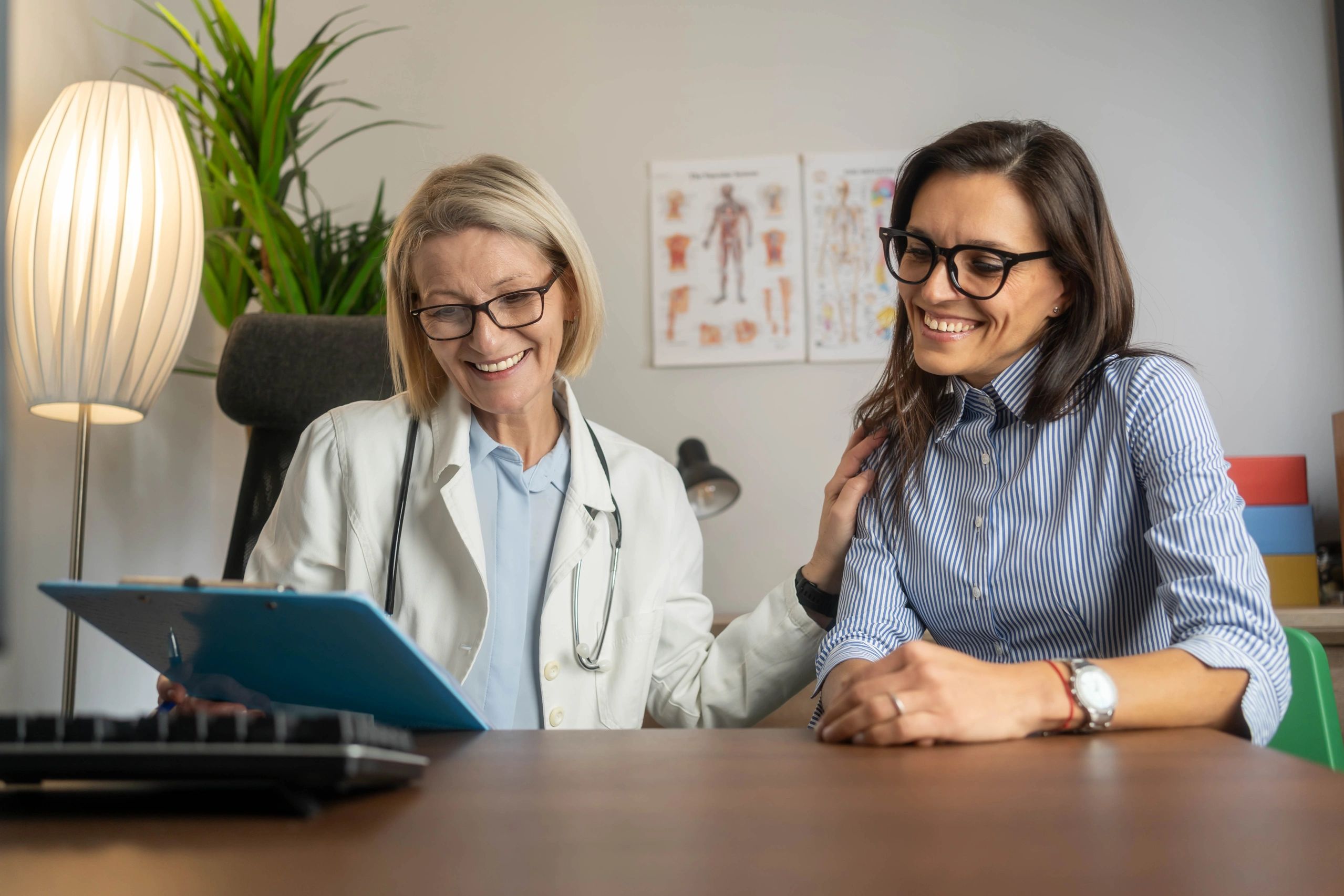 Woman smiling after hormone replacement therapy virtual consultation at home