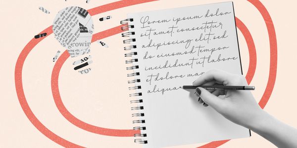 A hand writes cursive text in a notebook with a newspaper lightbulb and red swirl design.