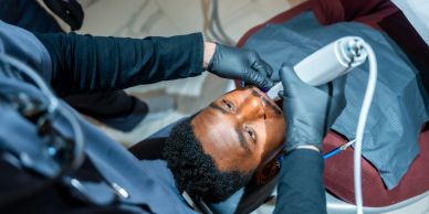 Dentist treating a patient in a clinic.